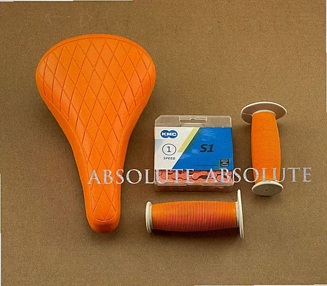 ORANGE DIAMOND STITCHED BMX BIKE SADDLE W/ BMX KMC CHAIN & MUSHROOM STYLE GRIPS.